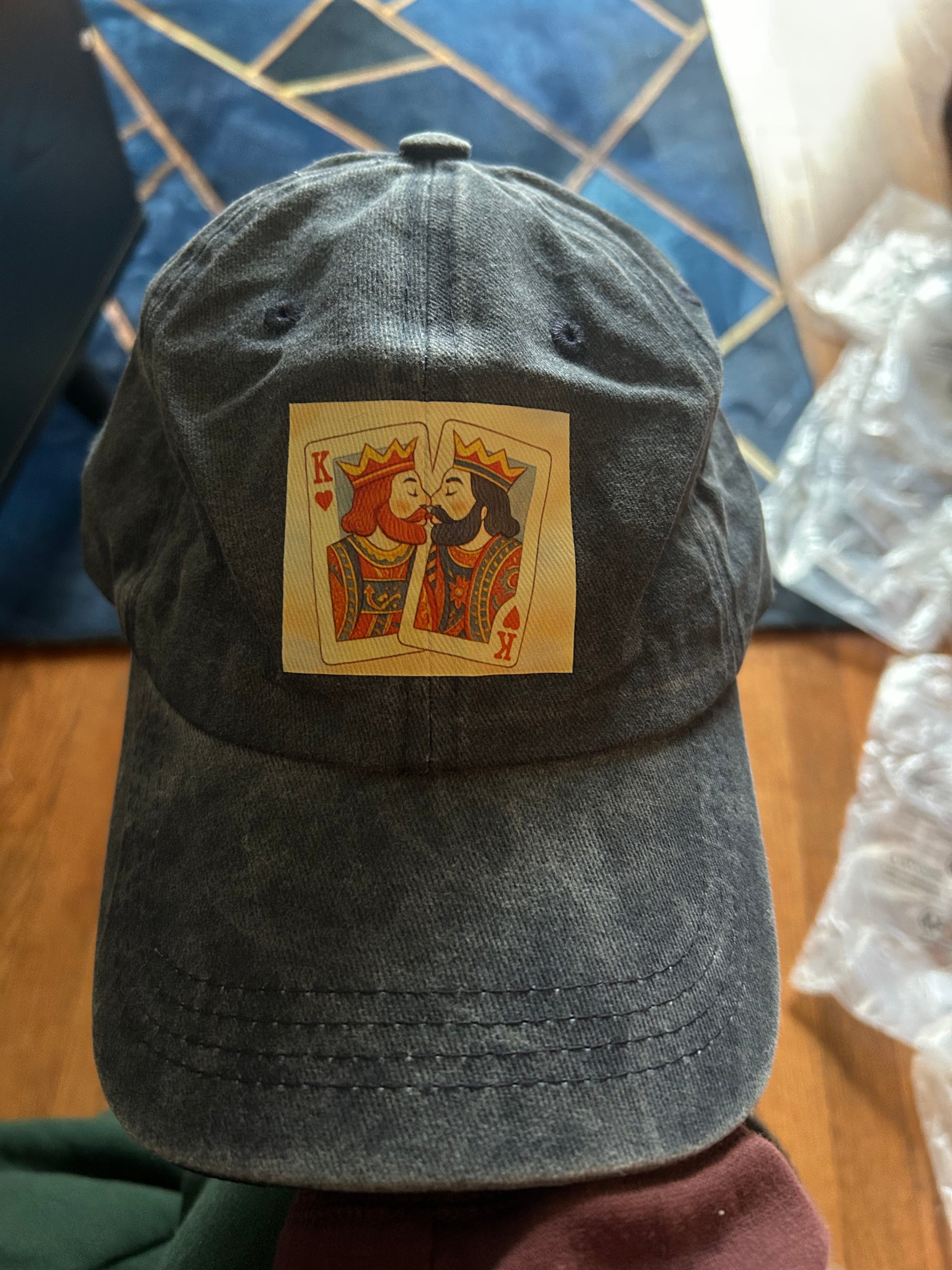 Two kings kissing baseball cap