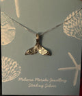 sterling silver engraved whale tail pendant